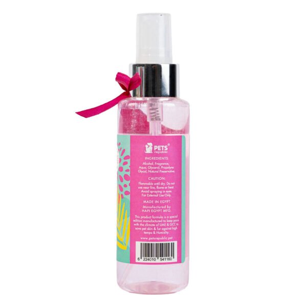 Backside image of Pets Republic Perfume 125ml Tropical Twist, showing the pink label with white and green accents, including ingredients and cautionary instructions.