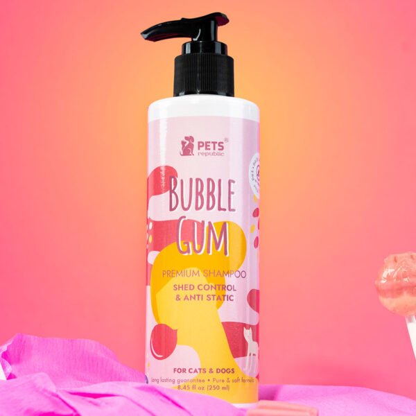 Pets Republic’s 250ml bottle of Shed Control & Anti-Static Tearless Shampoo with a bubble gum scent, displayed against a pink background with lollipop decorations