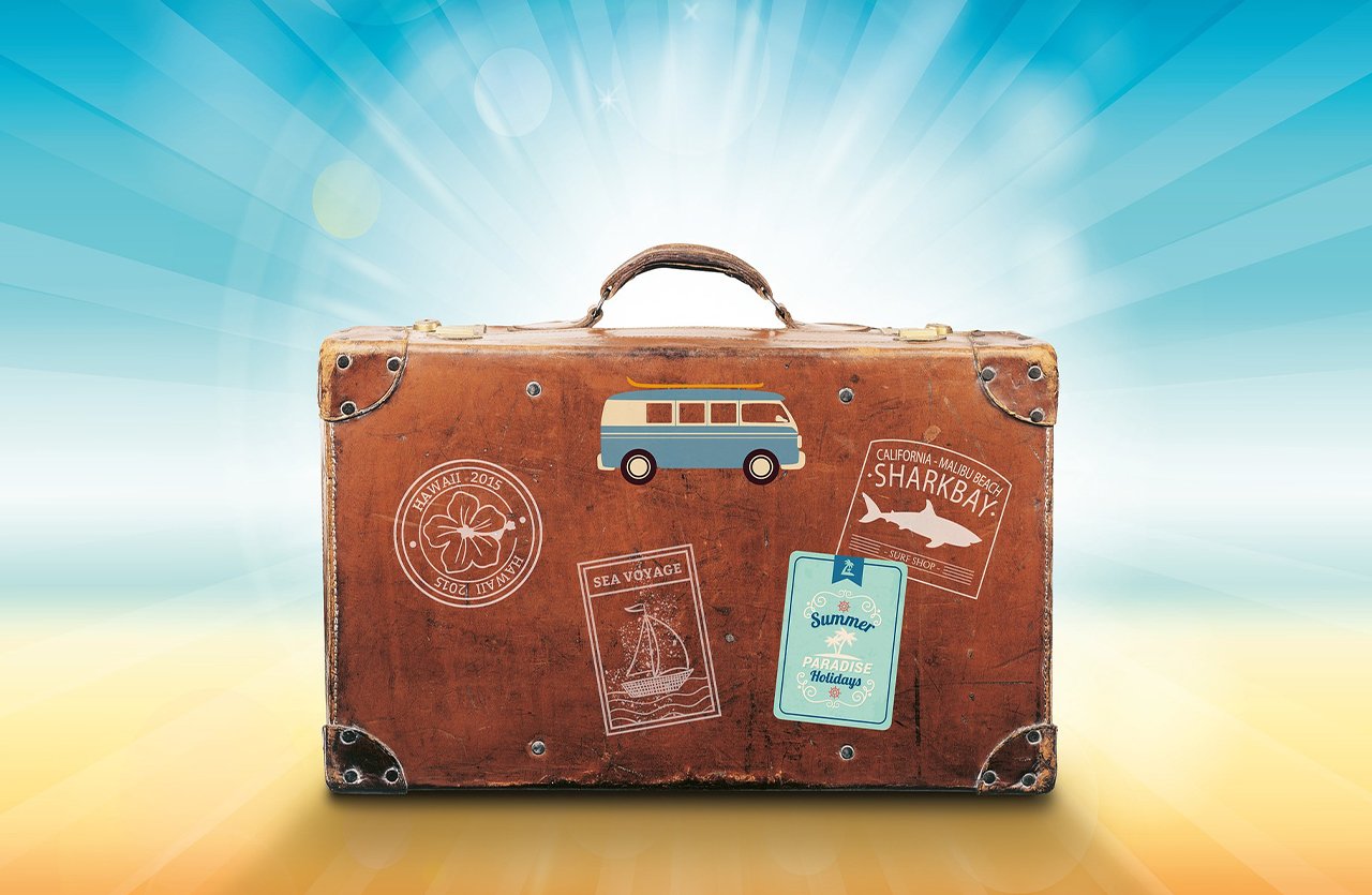 A vintage brown suitcase with travel stickers, illuminated by rays of light on a gradient blue and yellow background, symbolizing ease of travel with a single body wash sponge.