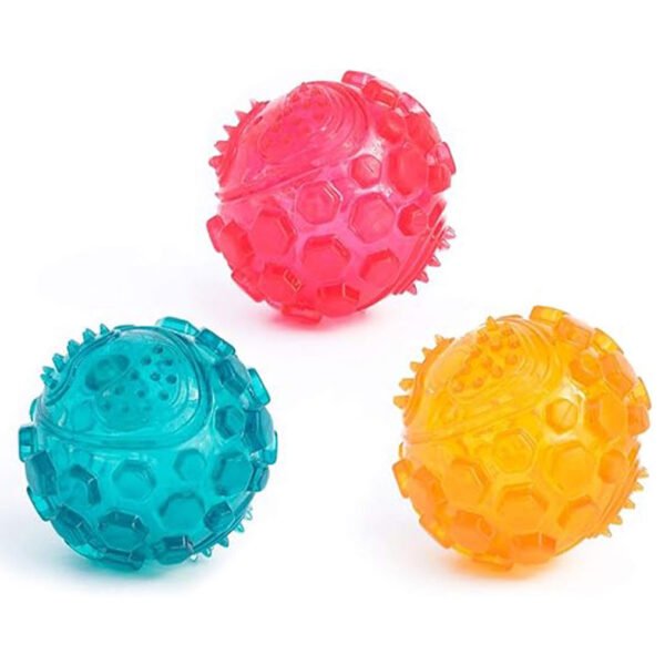 A collection of one piece each of the pink, yellow and teal zippytuff squeaker ball.