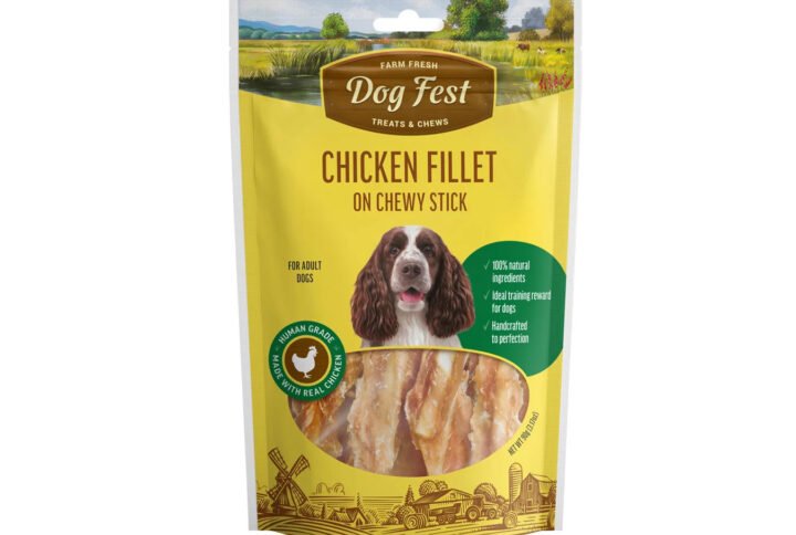 Packaging of ‘Chicken Fillet on Chewy Stick’ dog treats featuring a clear window displaying the product, with farm imagery and a happy dog in the background.