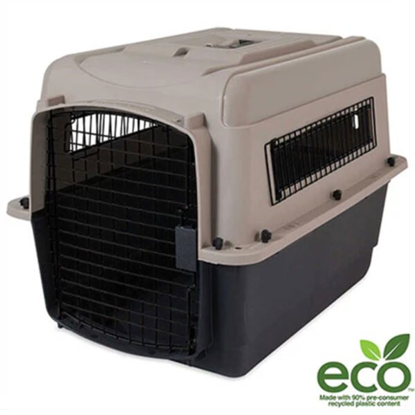 Image of a sturdy, two-tone (grey top and black base) Ultra Vari Kennel by Petmate with eco-friendly badge, featuring heavy-duty plastic construction and metal wire door for secure dog travel.