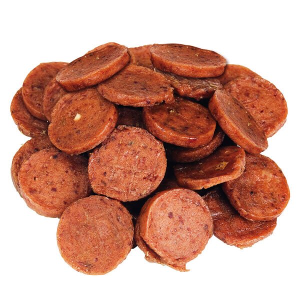 Close-up of round, sliced pieces of Lamb Medallions from Dog Fest, showcasing the reddish-brown color and visible seasonings, ideal for small breed dogs.