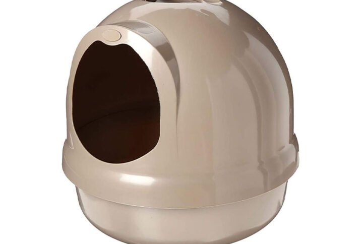 Beige Petmate Booda Dome Litter Box with a rounded design and front entrance hole