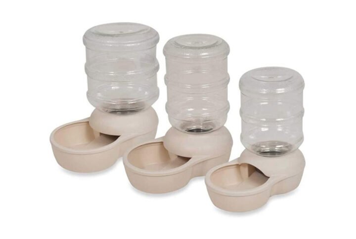 Three sizes of Lebistro Pet Waterer by Aspen Pet, featuring transparent tanks on beige bases