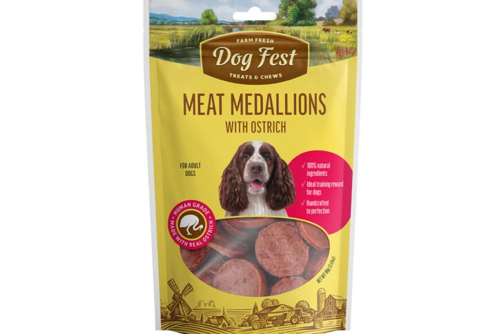 Packaging of Dog Fest Treats featuring Meat Medallions with Ostrich for adult dogs, displaying the product against a yellow background with farm imagery and a dog.