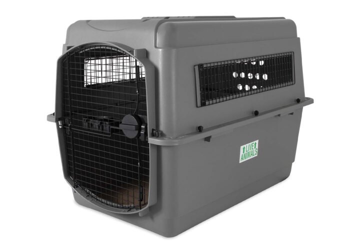A sturdy, grey Petmate Sky Kennel featuring a black wire door and side vents, designed for safe dog travel.