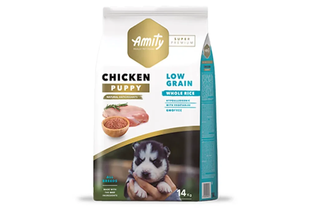 A bag of Amity Super Premium Low Grain Puppy Dog Dry Food Chicken, highlighting its carefully selected ingredients for healthy development, including strong muscles, cognitive function, and digestive support.