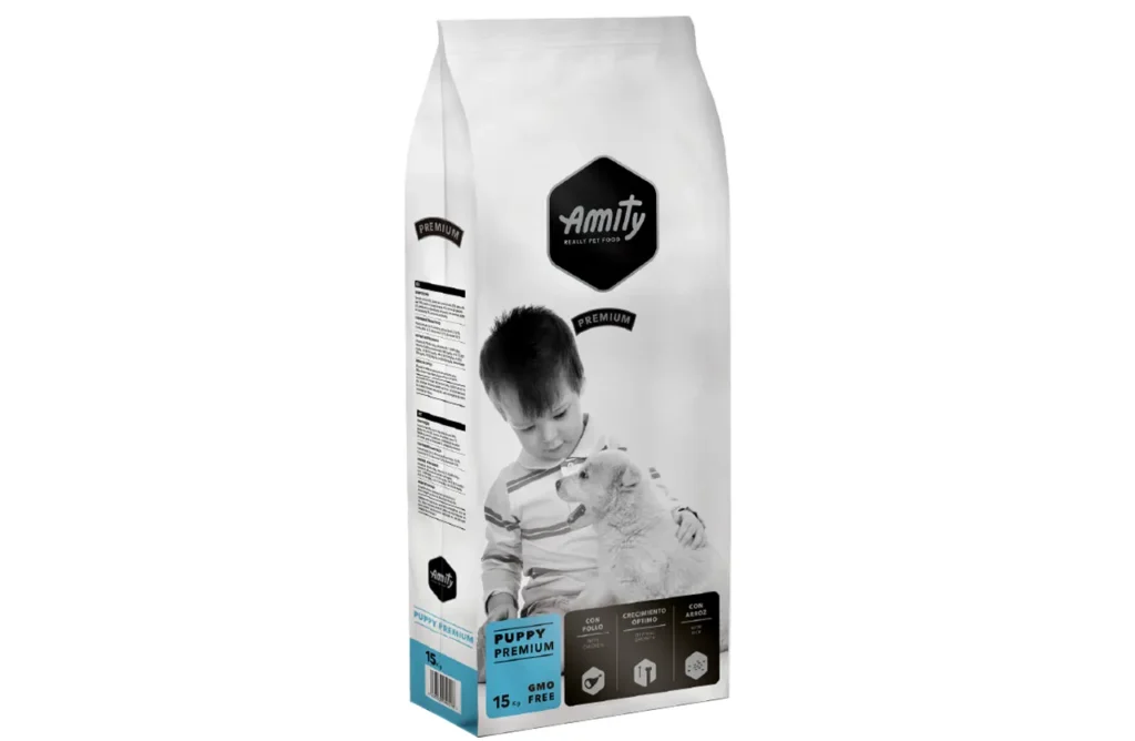 The front of a bag of Amity Premium Dog Dry Food Puppy Premium, featuring a graphic of a puppy, highlighting "Puppy Premium" and "15 kg," representing the simple, effective, and wholesome ingredients like dehydrated chicken protein, rice, and fish oil (DHA & Omega-3) for a strong start in life.