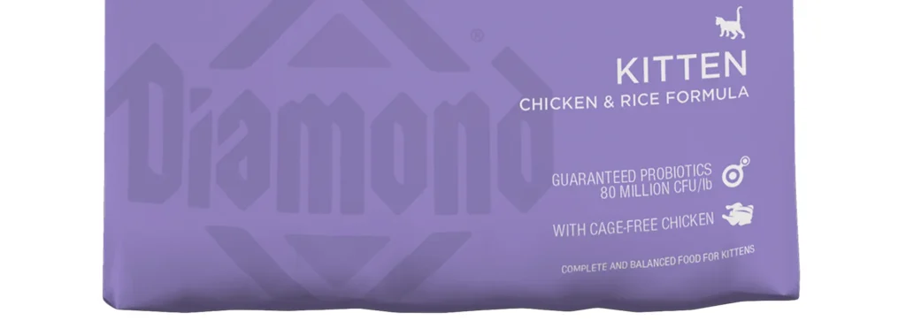 Close-up of the Diamond Naturals Kitten Chicken & Rice Formula bag, highlighting "Kitten" and "With Cage-Free Chicken."
