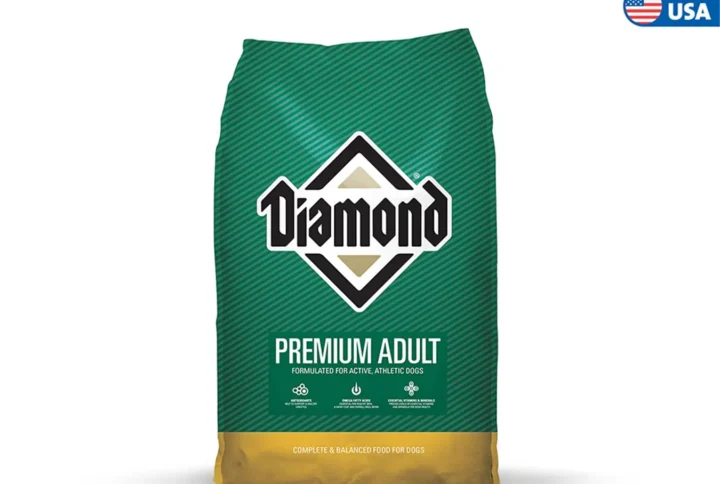 Studio shot of the Diamond Premium Adult bag in the classic green and yellow design. The bag features the prominent Diamond logo in the center, conveying trusted quality and balanced nutrition for adult dogs.